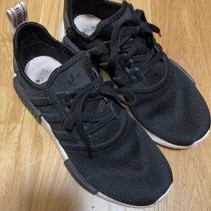Adidas NMD_R1 tennis shoes.